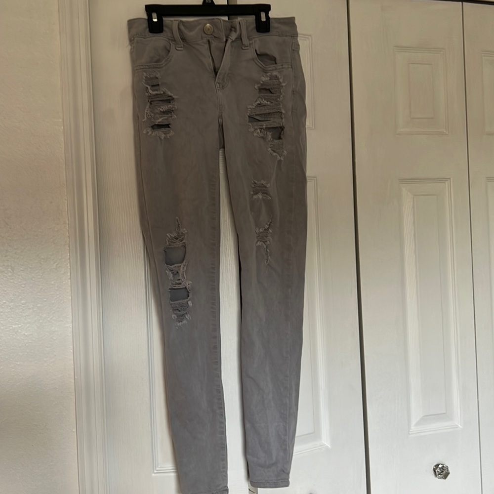 Gray American eagle ripped jeans, size 4 regular.